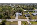 Aerial view of house and neighborhood at 825 Haleybury St, Port Charlotte, FL 33948