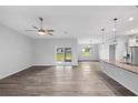 Spacious living area with hardwood floors and lots of natural light at 825 Haleybury St, Port Charlotte, FL 33948