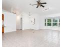 Spacious living room featuring tile flooring,high ceilings and multiple windows at 18882 Ayrshire Cir, Port Charlotte, FL 33948