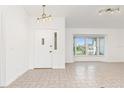 Bright and airy entryway with tile floors and bay window at 18882 Ayrshire Cir, Port Charlotte, FL 33948