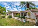 House exterior showcasing walkway and landscaping at 1150 Winston St, Port Charlotte, FL 33952