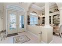 Bright and spacious entryway with tile floor and view to dining area at 3600 Kassandra Dr, Punta Gorda, FL 33950
