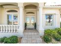 Elegant entryway with double doors and columns at 3600 Kassandra Dr, Punta Gorda, FL 33950