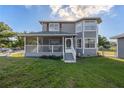 Two-story house with screened porch and attached garage at 16115 Aralia Dr, Punta Gorda, FL 33955