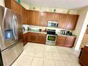 Spacious kitchen with granite countertops and stainless steel appliances at 24479 Vienison Ln, Punta Gorda, FL 33955