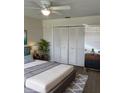 Bright bedroom with a large closet and virtually staged furniture at 3303 Ithaca St, Port Charlotte, FL 33952