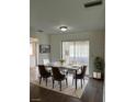 Dining room with virtually staged furniture and access to a patio at 3303 Ithaca St, Port Charlotte, FL 33952