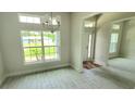 Bright dining area with tile floors and large windows at 174 Aurora St, Port Charlotte, FL 33948