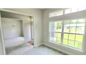 Spacious living area with large windows and tile floors at 174 Aurora St, Port Charlotte, FL 33948