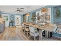 Farmhouse-style dining room with a large wooden table and built-in shelving at 380 W Wentworth St, Englewood, FL 34223