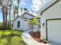 View of a house's exterior, showcasing the front entrance and walkway at 353 Campbell St, Port Charlotte, FL 33953