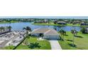 Aerial view of waterfront home with lush landscaping at 24303 Contra Costa Ln, Punta Gorda, FL 33955