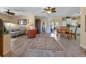 Open living room with dining area and view to backyard at 24275 Buckingham Way, Punta Gorda, FL 33980
