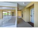 Condo hallway with light walls, white doors, and an exit sign at 19345 Water Oak Dr # 305, Port Charlotte, FL 33948