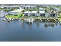 Aerial view of waterfront property with boat slips and community at 3600 Bal Harbor Blvd # 1G, Punta Gorda, FL 33950