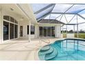 Inviting pool area with covered patio and tranquil golf course view at 3853 Bordeaux Dr, Punta Gorda, FL 33950