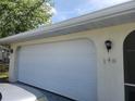 White garage door with house number 148 at 148 Angol St, Punta Gorda, FL 33983