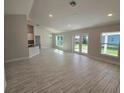 Open living room with tile floors and access to patio at 4051 Dotham St, Port Charlotte, FL 33948