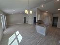 Island kitchen with granite countertops and stainless steel appliances at 4051 Dotham St, Port Charlotte, FL 33948