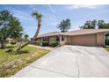 Brick ranch house with attached garage at 20567 Midway Blvd, Port Charlotte, FL 33952