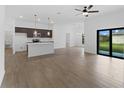Open concept living room and kitchen with tile flooring at 12550 Mohican Ave, Port Charlotte, FL 33953