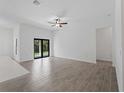 Spacious living room with tile floors and access to backyard at 4081 Felhorn St, Port Charlotte, FL 33948