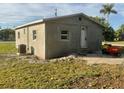 Newly constructed home with stucco exterior and a spacious yard at 612 Milus St, Punta Gorda, FL 33950