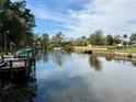 Scenic waterfront view with a private dock, perfect for boating and enjoying the serene surroundings at 5731 Oakview Ln, Punta Gorda, FL 33950