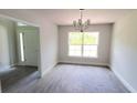 Simple dining room with hardwood floors and a large window at 2552 Jacobs St, Port Charlotte, FL 33953