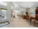Bright dining room with hardwood floors and view into the kitchen at 15 Windward Pl, Placida, FL 33946
