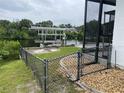 Backyard with canal access and chain link fence at 18029 Ohara Dr, Port Charlotte, FL 33948