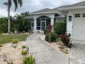 Walkway leading to the entrance of a single-story home at 18029 Ohara Dr, Port Charlotte, FL 33948