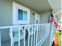 Condo balcony with white chairs, providing outdoor space at 3310 Loveland Blvd # 606, Punta Gorda, FL 33980