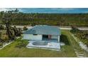Single-story home with pool and paved patio at 22528 Minerva Ave, Port Charlotte, FL 33954