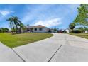 Curved driveway leading to a single-story home at 27437 San Marino Dr, Punta Gorda, FL 33983