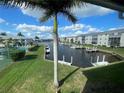 Stunning waterfront view of canal, boats, and lush landscaping at 3600 Bal Harbor Blvd # 2-O, Punta Gorda, FL 33950