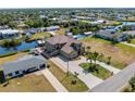 Aerial view of waterfront home with canal access at 18189 Ohara Dr, Port Charlotte, FL 33948