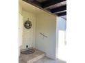 Inviting front entry with wreath, tiled flooring, and convenient handrail at 3830 Bal Harbor Blvd # 2, Punta Gorda, FL 33950