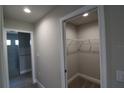 Walk-in closet with wire shelving and carpeted floor at 8124 Welsford Rd, Port Charlotte, FL 33981
