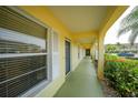 Yellow building with green walkway and landscaping at 4000 Bal Harbor Blvd # 214, Punta Gorda, FL 33950