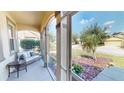 Relaxing screened porch with seating area overlooking the yard at 10034 Winding River Rd, Punta Gorda, FL 33950