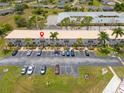 Aerial view showing condo building location and surrounding parking at 26485 Rampart Blvd # D3, Punta Gorda, FL 33983