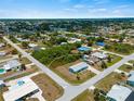 Aerial view showing a single Gathering home in a residential neighborhood at 282 Seminole Nw Blvd, Port Charlotte, FL 33952