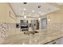 Updated kitchen with granite countertops and stainless steel appliances at 8750 Midnight Pass Rd # 202, Sarasota, FL 34242
