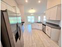 Spacious kitchen featuring stainless steel appliances and light wood cabinets at 9267 Waldrep St, Port Charlotte, FL 33981