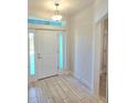 Light and airy foyer with tile floors and a view to the outside at 9267 Waldrep St, Port Charlotte, FL 33981