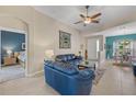 Living room with blue leather sofas and view of Primary bedroom at 24449 Manchester Trl, Punta Gorda, FL 33980