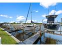 Three boat slips with boats parked, offering convenient waterfront access at 3500 Mondovi Ct # 1022, Punta Gorda, FL 33950