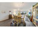 Bright dining area with seating for four and hardwood floors at 23465 Harborview Rd # 723, Port Charlotte, FL 33980