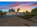 Charming single-story home featuring a well-manicured lawn and an inviting entrance perfect for relaxing at 27437 Dutch Ave, Punta Gorda, FL 33982